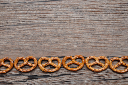 A row of golden brown pretzelsの写真素材