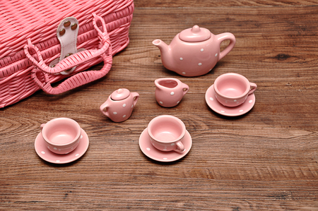 A porcelain spotted tea set with a pink basketの写真素材