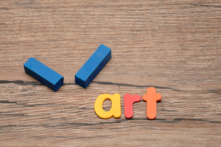 A broken blue pastel with the word artの写真素材