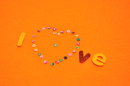 A heart made out of colorful pictures and the word loveの写真素材