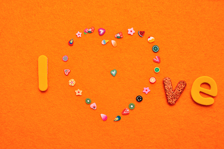 A heart made out of colorful pictures and the word loveの写真素材