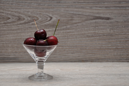 Cherries in a glass bowlの写真素材