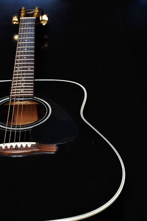 Close up of a guitar with shallow depth of field