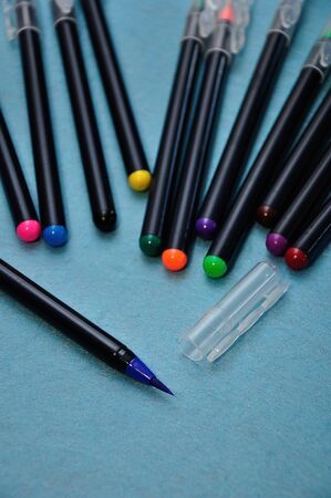 A blue color pen with the rest out of focus on a blue backgroundの写真素材
