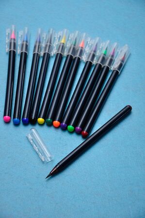 A brown color pen with the rest out of focus on a blue backgroundの写真素材