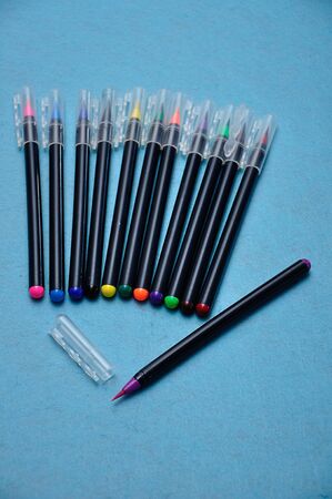 A purple color pen with the rest out of focus on a blue backgroundの写真素材