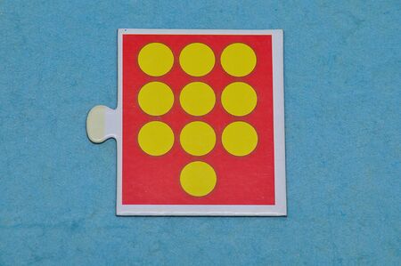 A jigsaw piece with ten dotsの写真素材