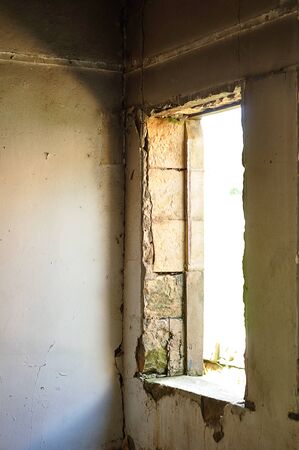 A window of an abandoned buildingの写真素材