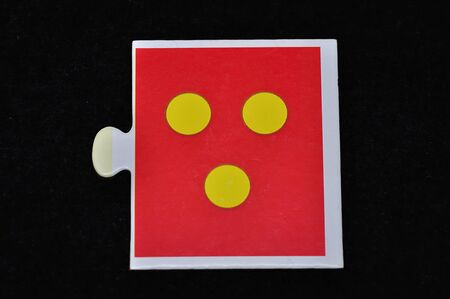 A jigsaw piece with three dotsの写真素材