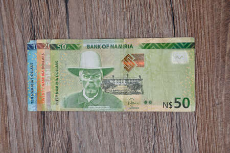 Roodepoort , South Africa 27 March 2020. A display of different Namibia dollars on a wooden...