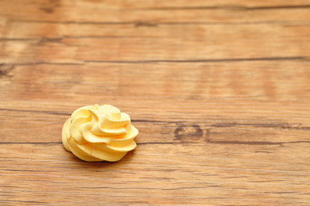 A yellow meringue on a tableの写真素材