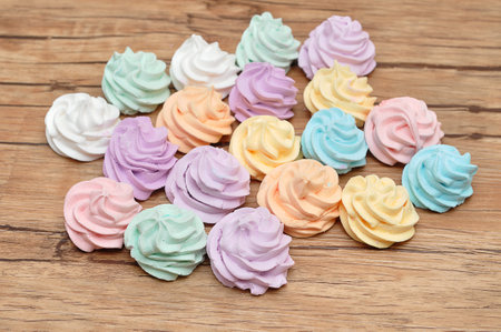 A variety of pastel color meringues on a tableの写真素材