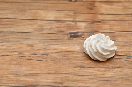 A white meringue on a tableの写真素材