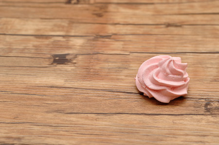 A pink meringue on a tableの写真素材