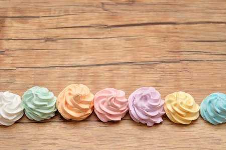 A row of meringues on a tableの写真素材