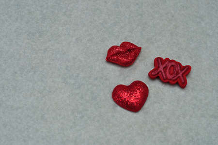 Red lips, hugs and kisses and a red heart isolated on white backgroundの写真素材
