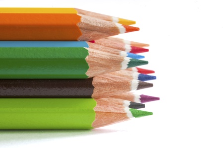 Manycolored penciles on the white background. Space for your text