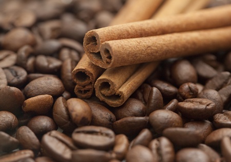 Cinnamon sticks on coffee beans backgroundの写真素材