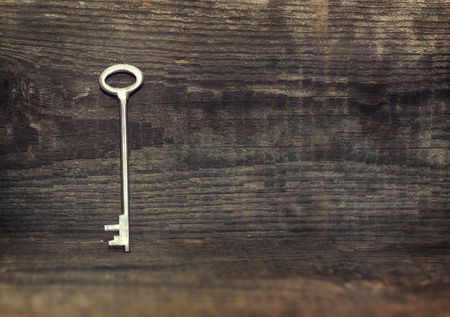Key on the old  wooden background の写真素材