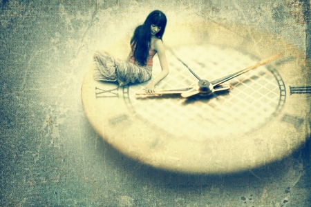 Young woman want to stop time. Old style imageの写真素材