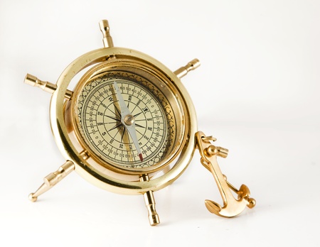 Golden old  compass with anchor  over white background