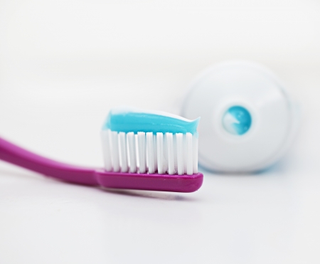 Tooth brush with paste on white backgroundの写真素材