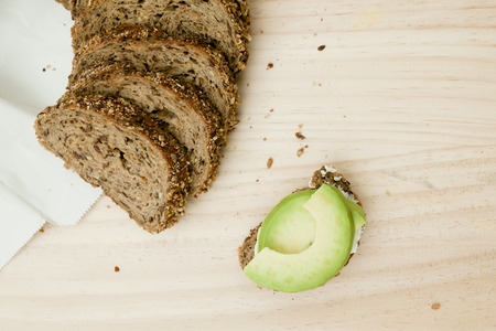 Avocado tasty  toast on the wooden backgroundの写真素材