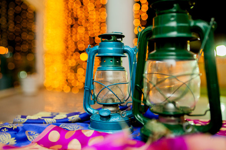 Two lanterns on beautiful golden  bokeh backgroundの写真素材