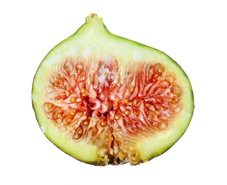 Cuted half of fresh fig isolated on the white background