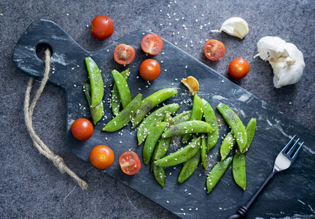Homemade sauteed sugar snap peas with cherry tomatoの写真素材