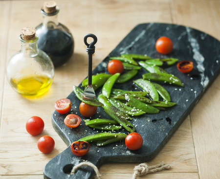 Homemade sauteed sugar snap peas with cherry tomatoの写真素材