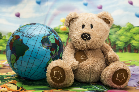 Bear and ball in nature decorationの写真素材