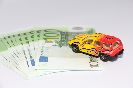 Car loan. Car on the background of currency. Money can be taken in the bank. The picture is not a background.の写真素材