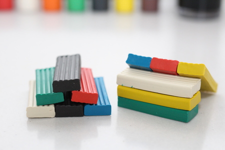 Multicolored bright plasticine on a white background. Picture for creative people. Work in creative...