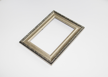 Aged frame for a photo, picture or certificate. Photo on a white background. There is nothing in the frame.の写真素材