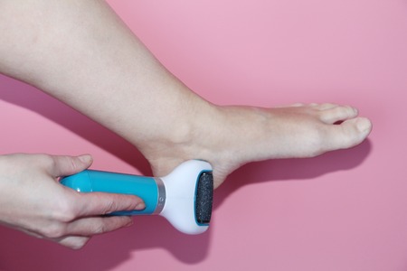 In the female hand machine for processing heels of legs.の写真素材