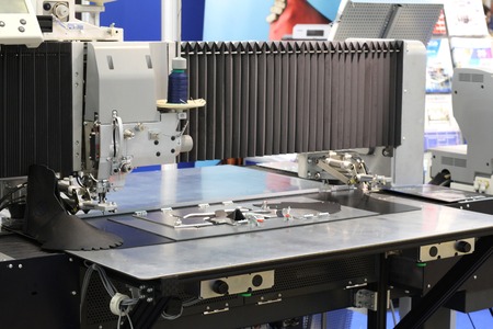 Industrial equipment for working with leather. Cutting leather goods. Factory.