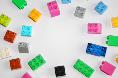 Moscow, RF, 04.09.2019: Plastic building blocks on a white background. Multi-colored cubes LEGO for children. White backgroundのeditorial素材