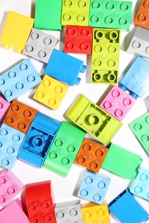Moscow, RF, 04.09.2019: Plastic building blocks on a white background. Multi-colored cubes LEGO for children. White backgroundのeditorial素材
