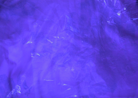 The texture of blue oilcloth. Deep blue color, close-up. Template for cards.