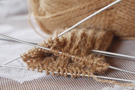 Skein thread and knitting needles. Knit. Needlework. Knitting wool toe knitting. Work has begun....