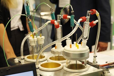 Chemical laboratory in which experiments are carried out. Flasks and test tubes stand on devices for...