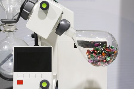 Chemical laboratory in which experiments are carried out. Flasks and test tubes stand on devices for chemical synthesis.の写真素材