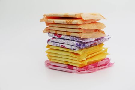 A lot of feminine sanitary pads in the package. Gaskets are stacked on top of each other. Gaskets for monthly use. Hygiene.の写真素材