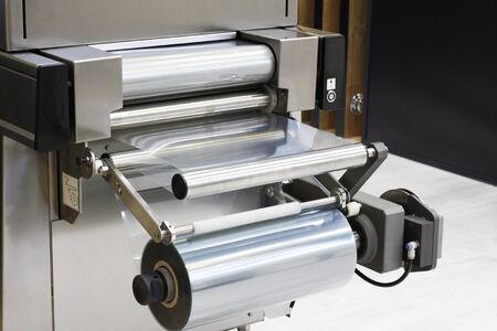 Automatic packing machine. Filling equipment. Packing in a transparent cellophane film. Designing...