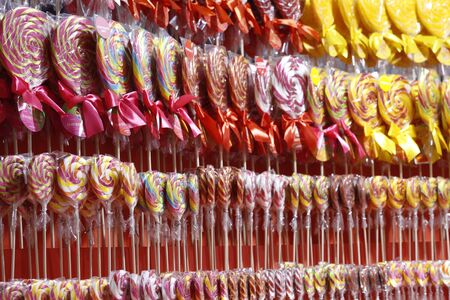 Moscow, RF, 02.10.2020: Candy on a stick. Mixed colorful fruit sweets. Colorful candies, sweets and chewing gum. The concept is a sweet life. Caramel in the package.のeditorial素材