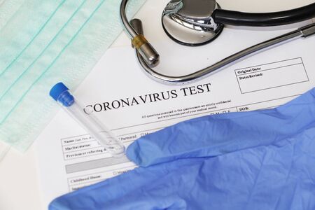 Laboratory test for the determination of coronavirus. Concept. Questionnaire for analysis. Consent to testing. On the table lies the consent to take tests. Coronavirus laboratory test.の写真素材