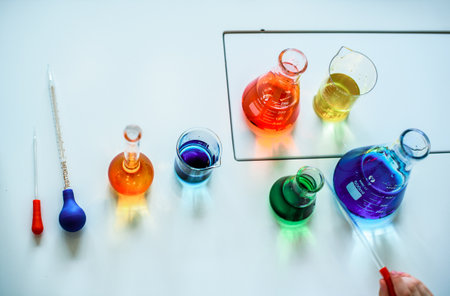 Chemistry laboratory. Conducting a chemical experiment. Experiments in the laboratory. Flasks and test tubes with colored liquid. The child conducts an experiment in a chemical laboratory. The science.の写真素材
