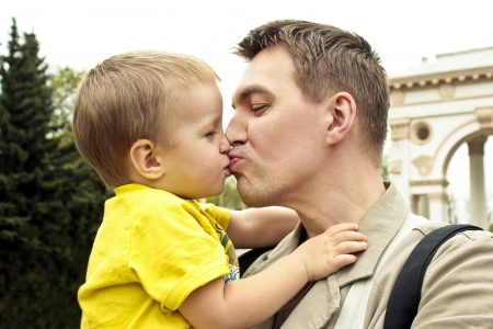 Man kisses and hugs baby の写真素材
