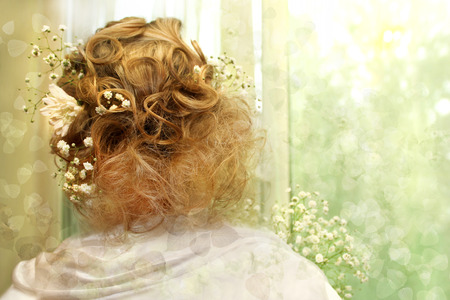 	  Beautiful light hairstyle on a girl with blond hair and with vibrant colors の写真素材